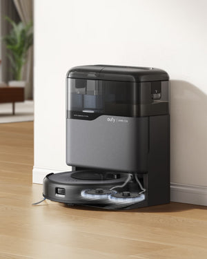Robotic vacuum cleaner on a wooden floor with a modern interior background