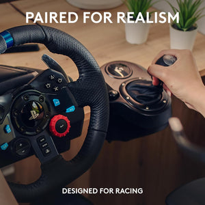 Steering wheel and gear shift controller with a hand on a wooden desk, text 'Paired for Realism' and 'Designed for Racing'.